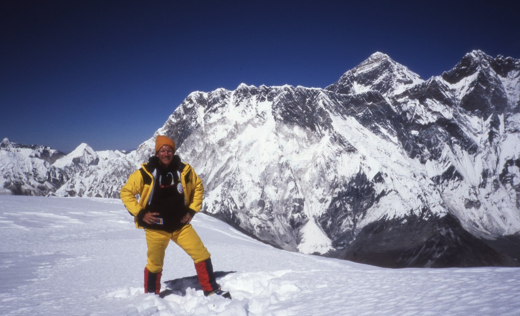 Bo Belvedere Christensen on the summit of Ama Dablam with Everest and Nuptse as backdrop