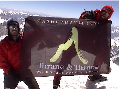 Mads and Jan on the summit of Gasherbrum I showing our sponsors flag